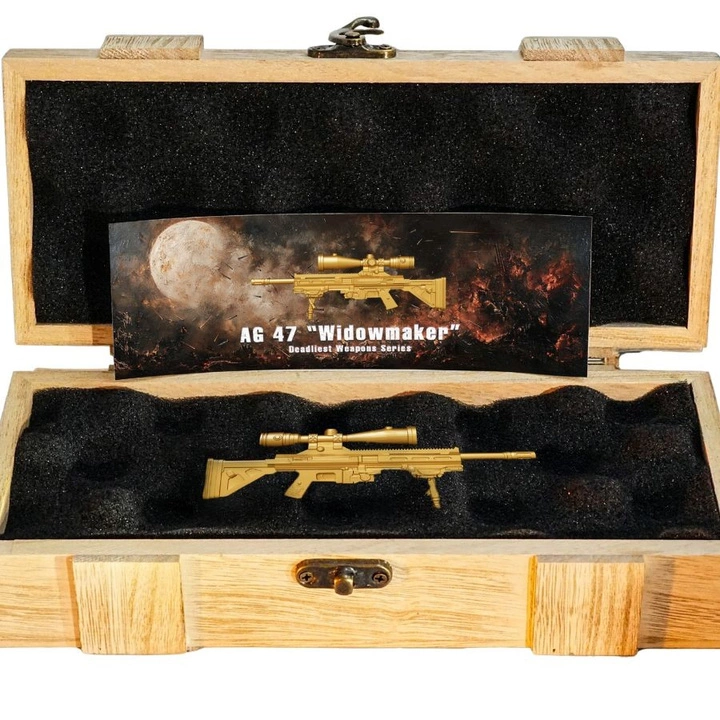 Cameroon Deadliest Weapon - AG 47 Widowmaker Mystery Box (losowa moneta z serii) 2 uncje Srebra 2025 Shaped Coin